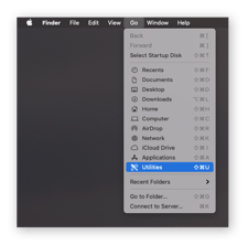 Mac homescreen s "Go" vybraným z horního panelu nabídek a" Utilities " vybraným z rozbalovací nabídky