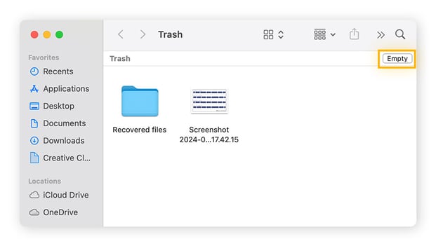 Emptying the Trash on macOS to complete bloatware uninstallation.