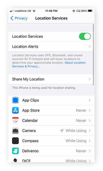 A view of the location services settings in iPhone. Apps like Camera and Deliveroo are shown.