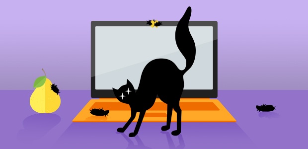 Black cat arching its back in front of a laptop with hairballs on the webcam and keyboard.